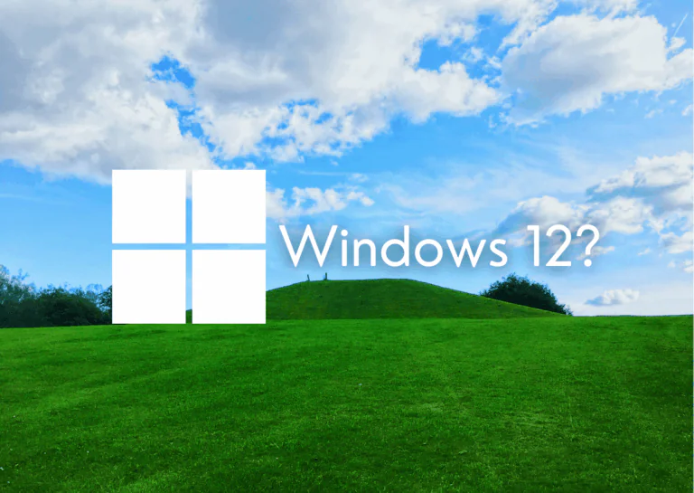 Ao fundo, uma paisagem de campo verde com céu azul e nuvens, em referência ao papel de parede característico das primeiras versões do Windows e, sobre ela está a logo do Windows em branco, e, ao lado, escrito "Windows 12?".